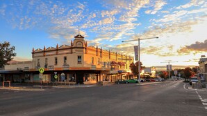 A street view with a building labeled '1909 Fagans Buildings' and 'Martins' shops.