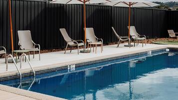 Outdoor pool, pool umbrellas, pool loungers