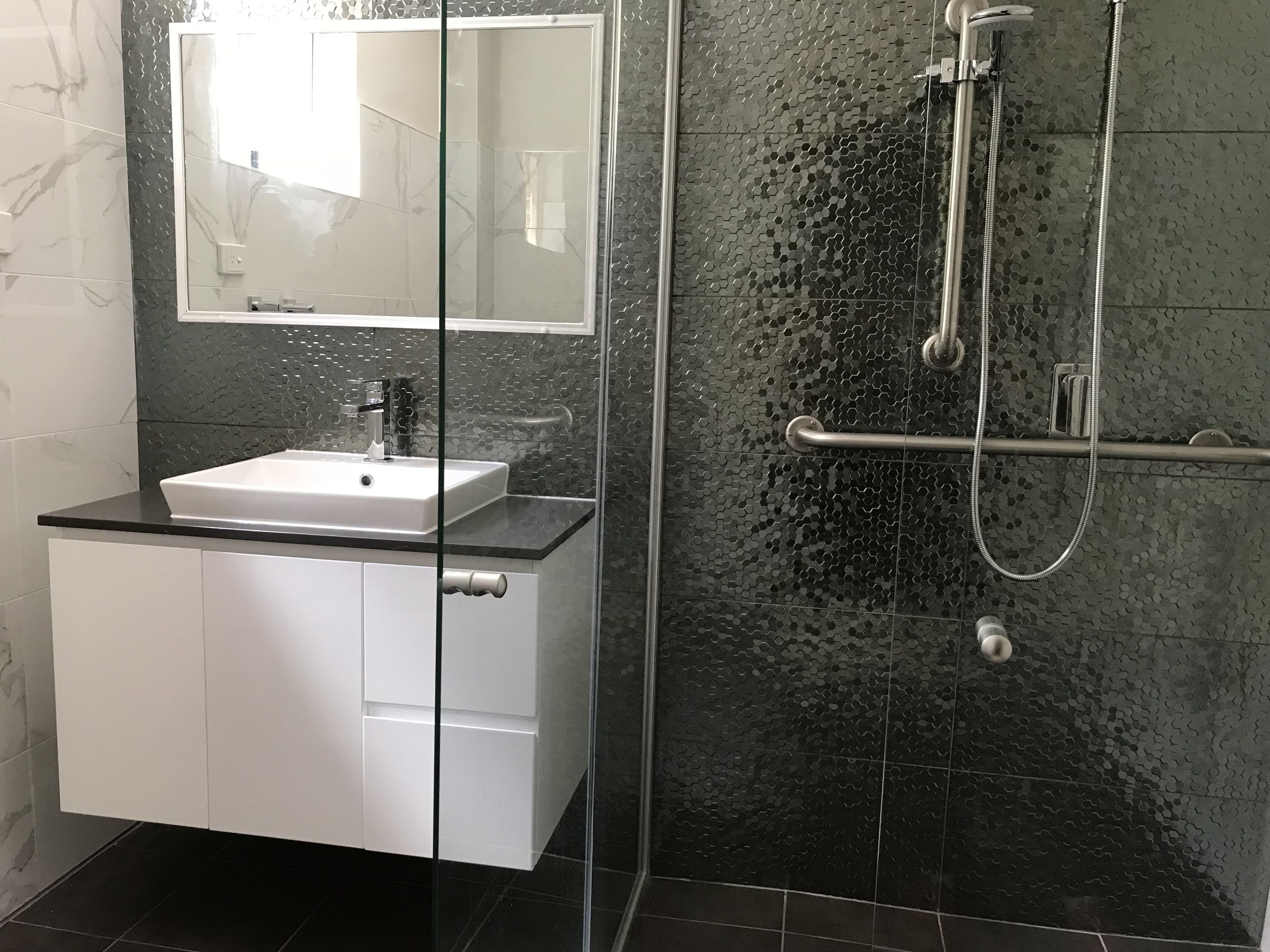 Shower, rainfall showerhead, hair dryer, towels