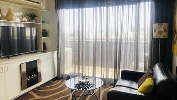Deluxe Apartment, 1 Bedroom | Individually decorated, individually furnished, desk, iron/ironing board