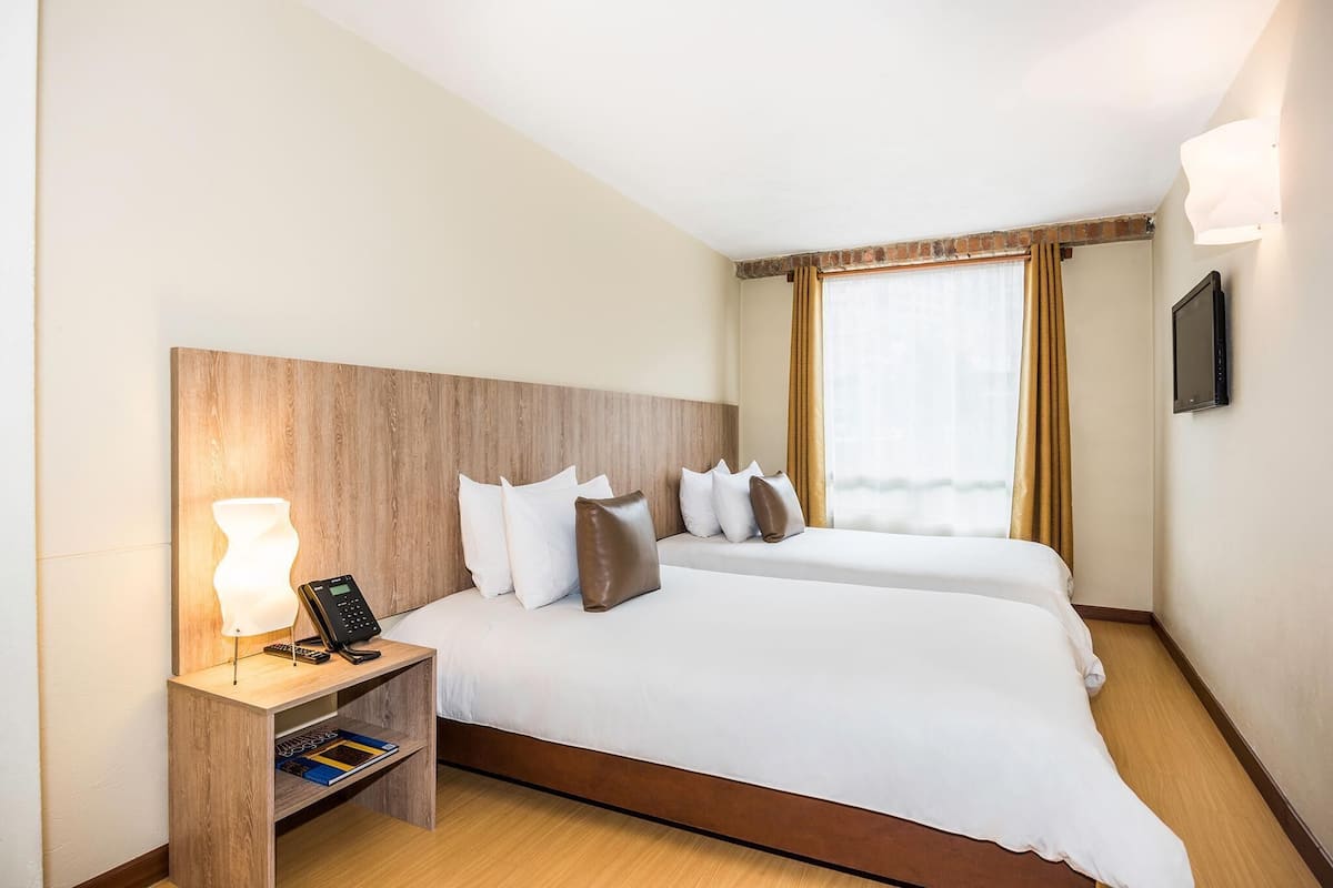 Biancheria da letto di alta qualità, minibar, cassaforte in camera