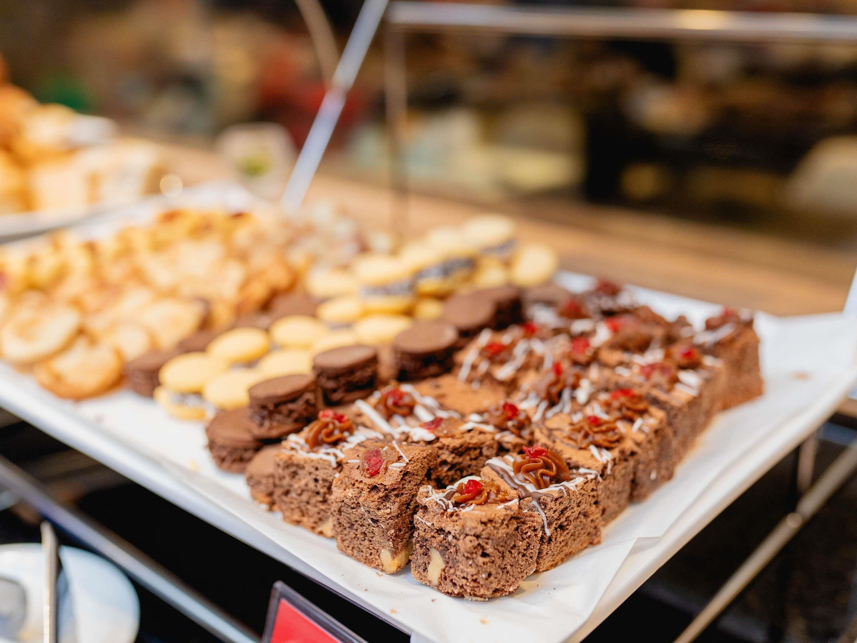 A dessert display with various baked goods.