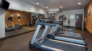 A gym with treadmills, stationary bikes, and a weight machine. - Comfort Suites Natchitoches (Natchitoches)