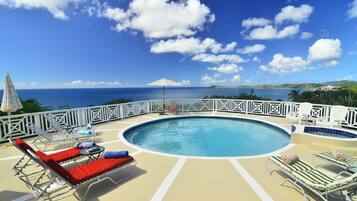 Outdoor pool, pool umbrellas, sun loungers