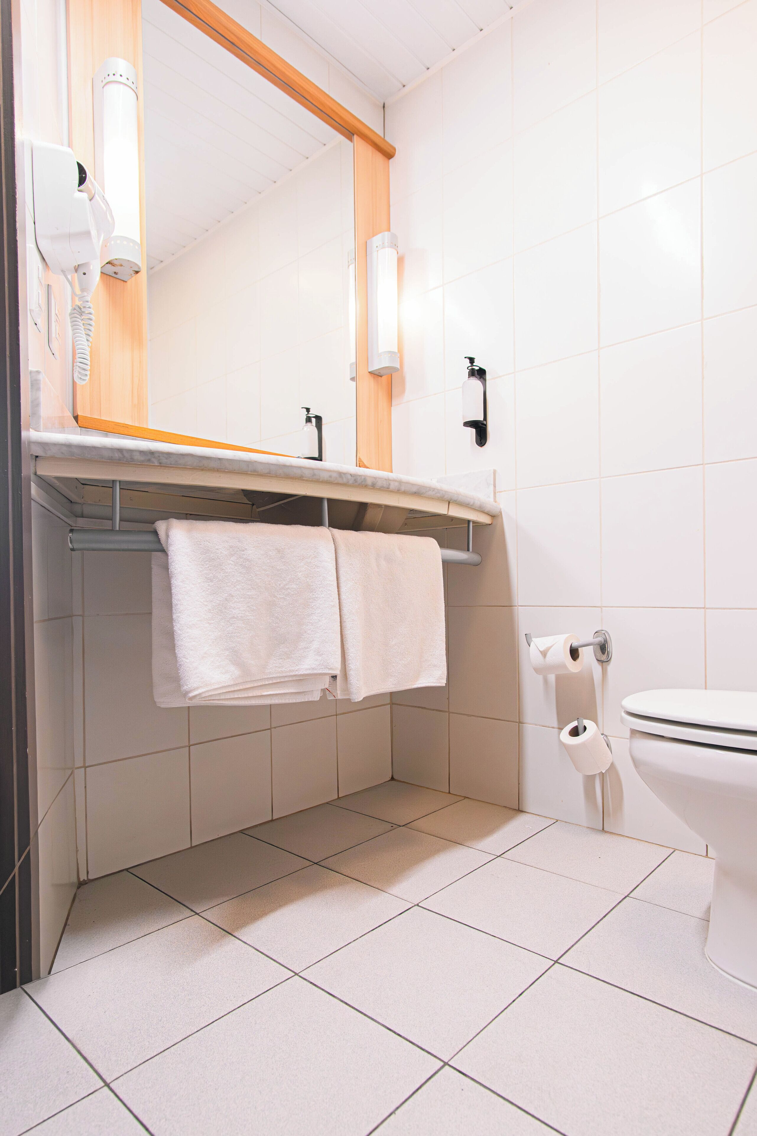 Shower, eco-friendly toiletries, hair dryer, towels