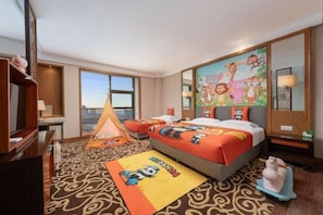 A hotel room with a large bed, a tent, and a mural on the wall.