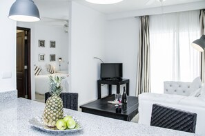 Comfort Studio | Living room | 32-inch flat-screen TV with cable channels, TV