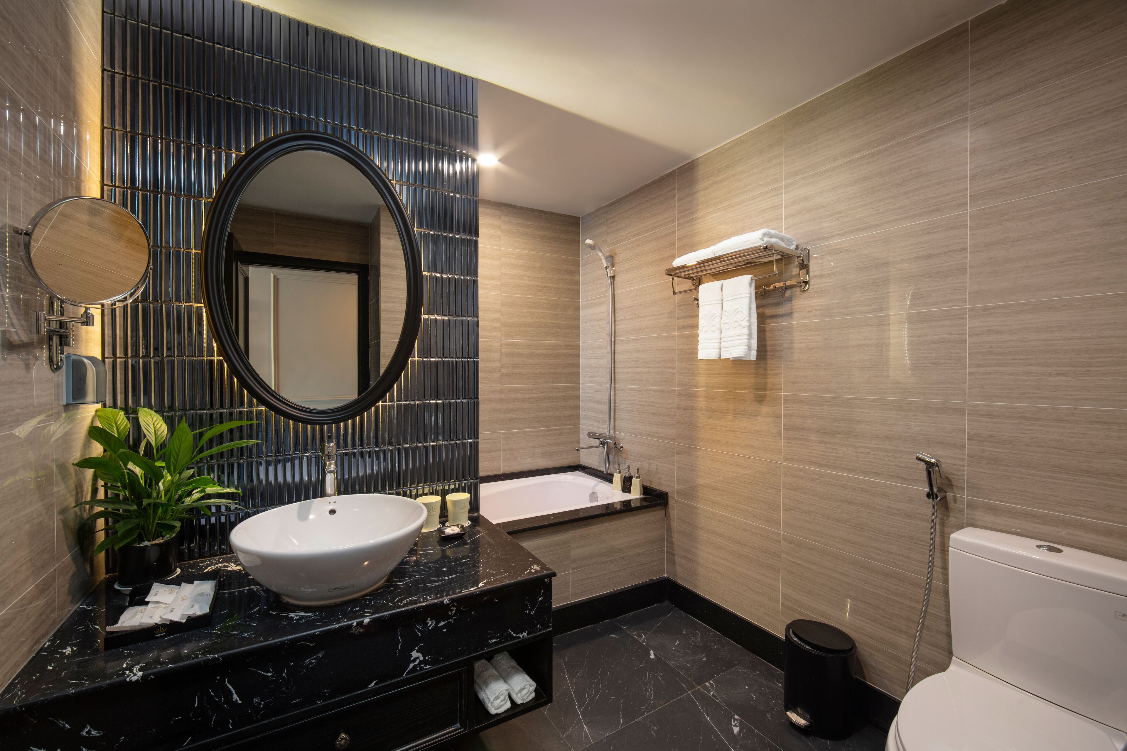 deep-soaking bathtub, rainfall showerhead, designer toiletries