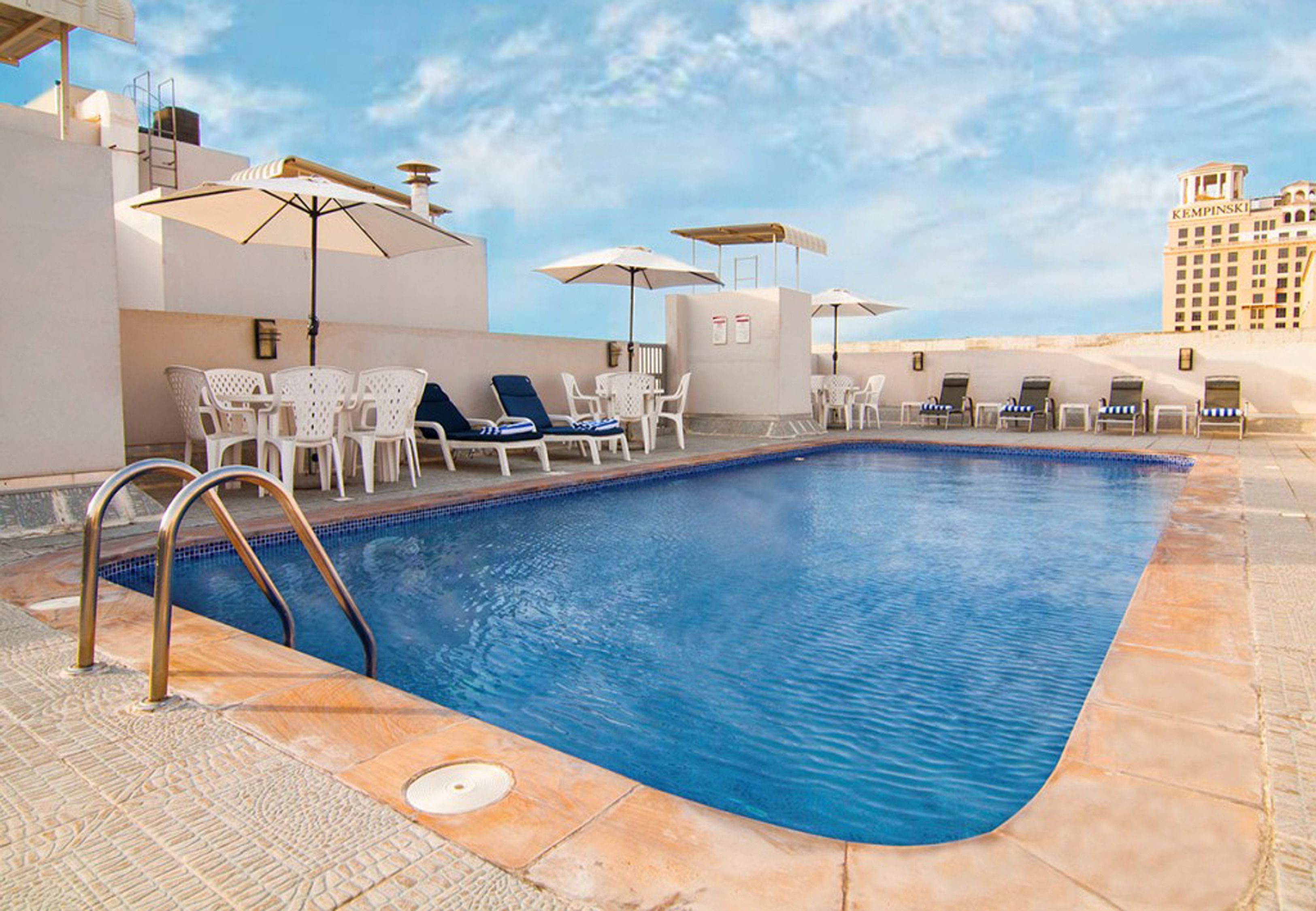 Outdoor pool, pool umbrellas, sun loungers