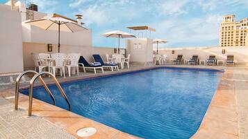 Outdoor pool, pool umbrellas, sun loungers