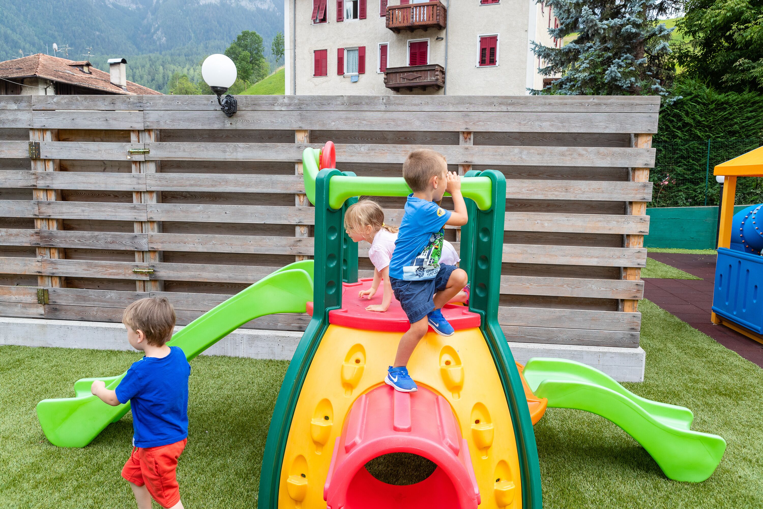 A playground with a slide and climbing structures.