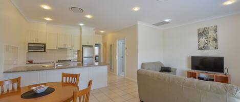 Standard Apartment, 2 Bedrooms, Non Smoking, Kitchen | Living room | 55-inch TV with cable channels, Netflix, streaming services