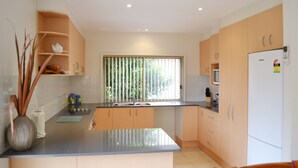 Standard Apartment, 1 Bedroom, Non Smoking, Kitchen (Townhouse min 2) | Iron/ironing board, WiFi (free), individually furnished, bed sheets - Parker by the Sea (Surf Beach)