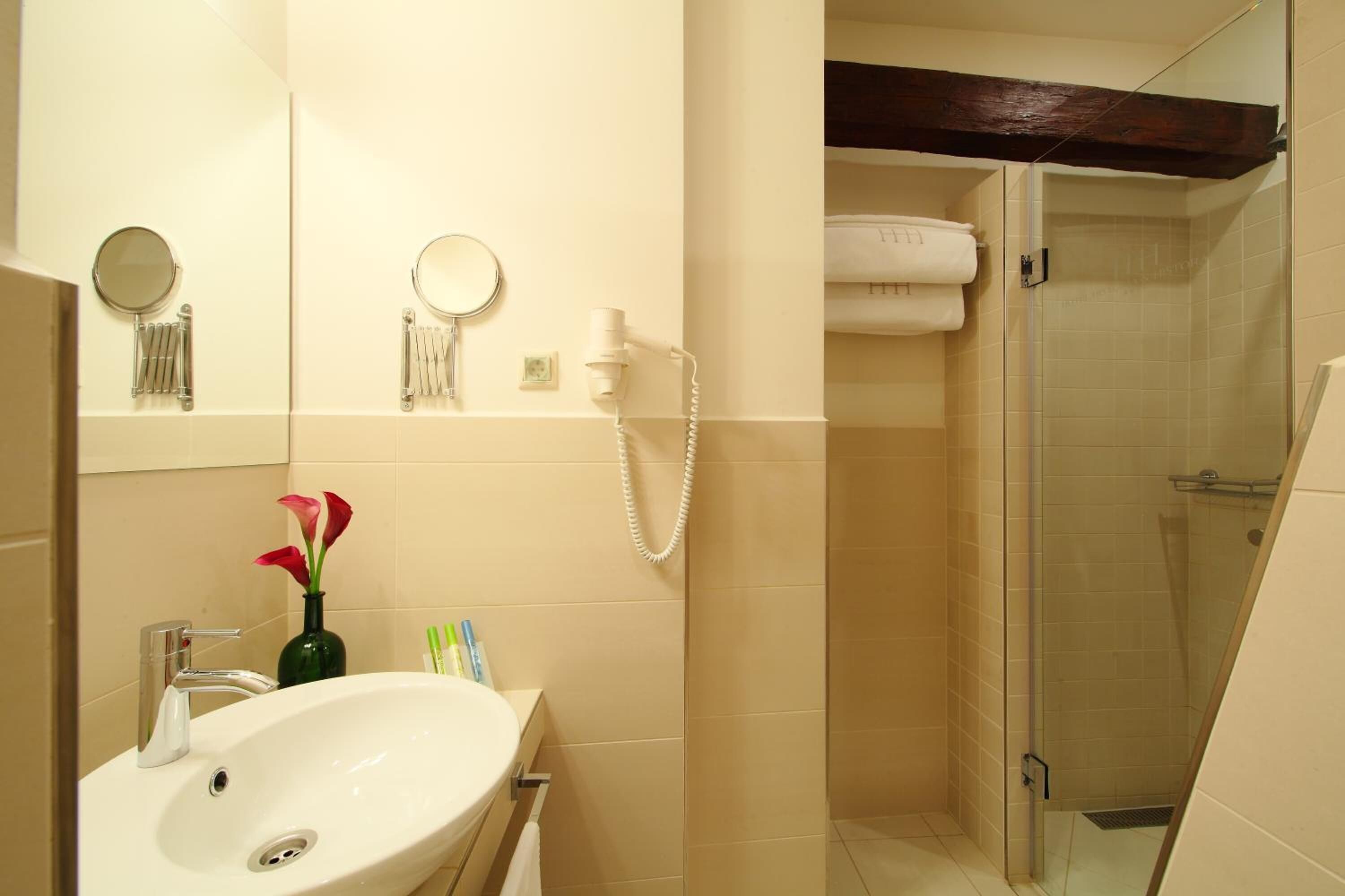 shower, hair dryer, bathrobes, slippers