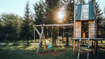 Explore the great outdoors in this park-like setting, complete with a swing set and lookout.
