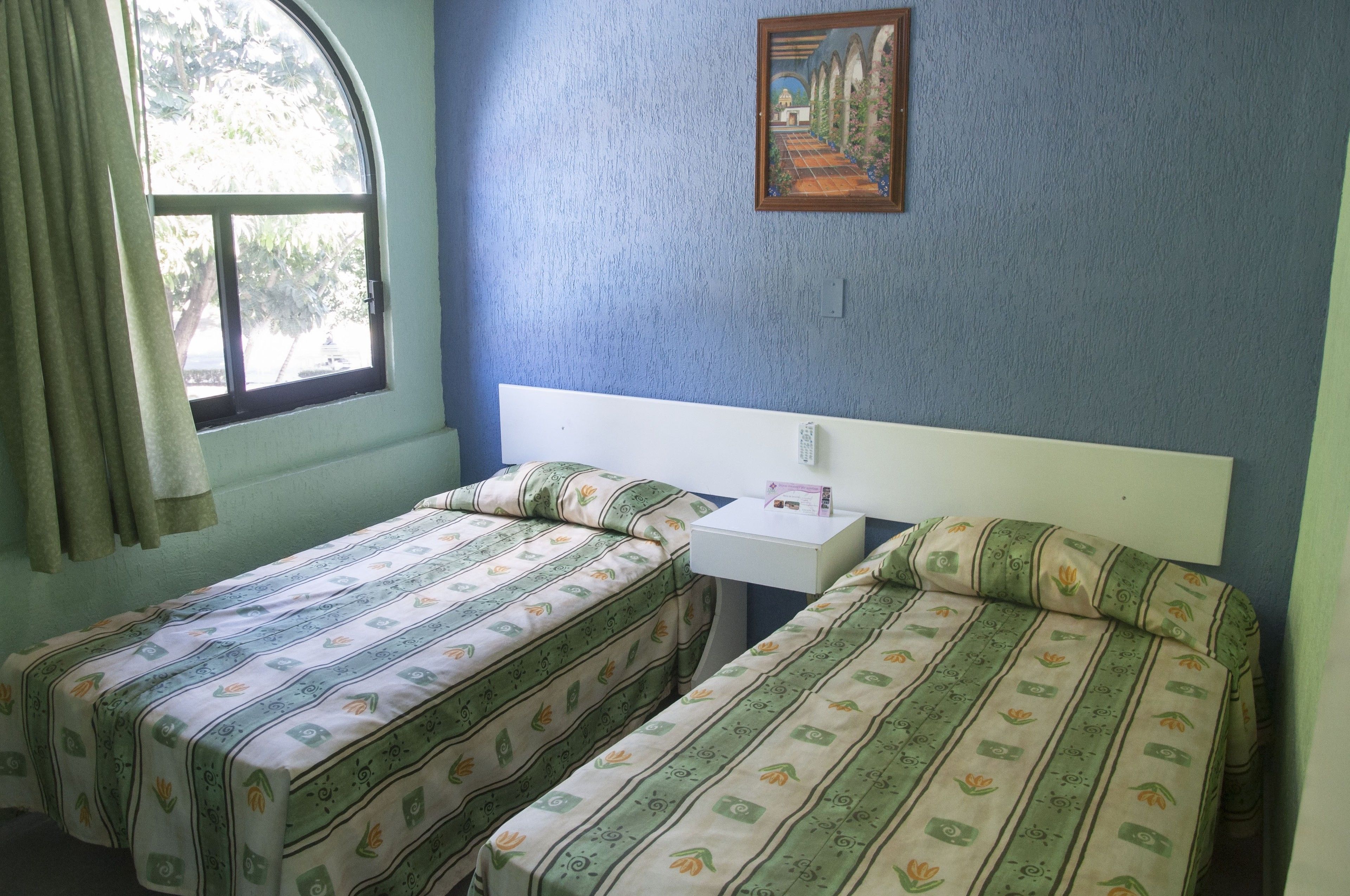 Habitación cuádruple "Palmas" | Wifi gratis y ropa de cama 