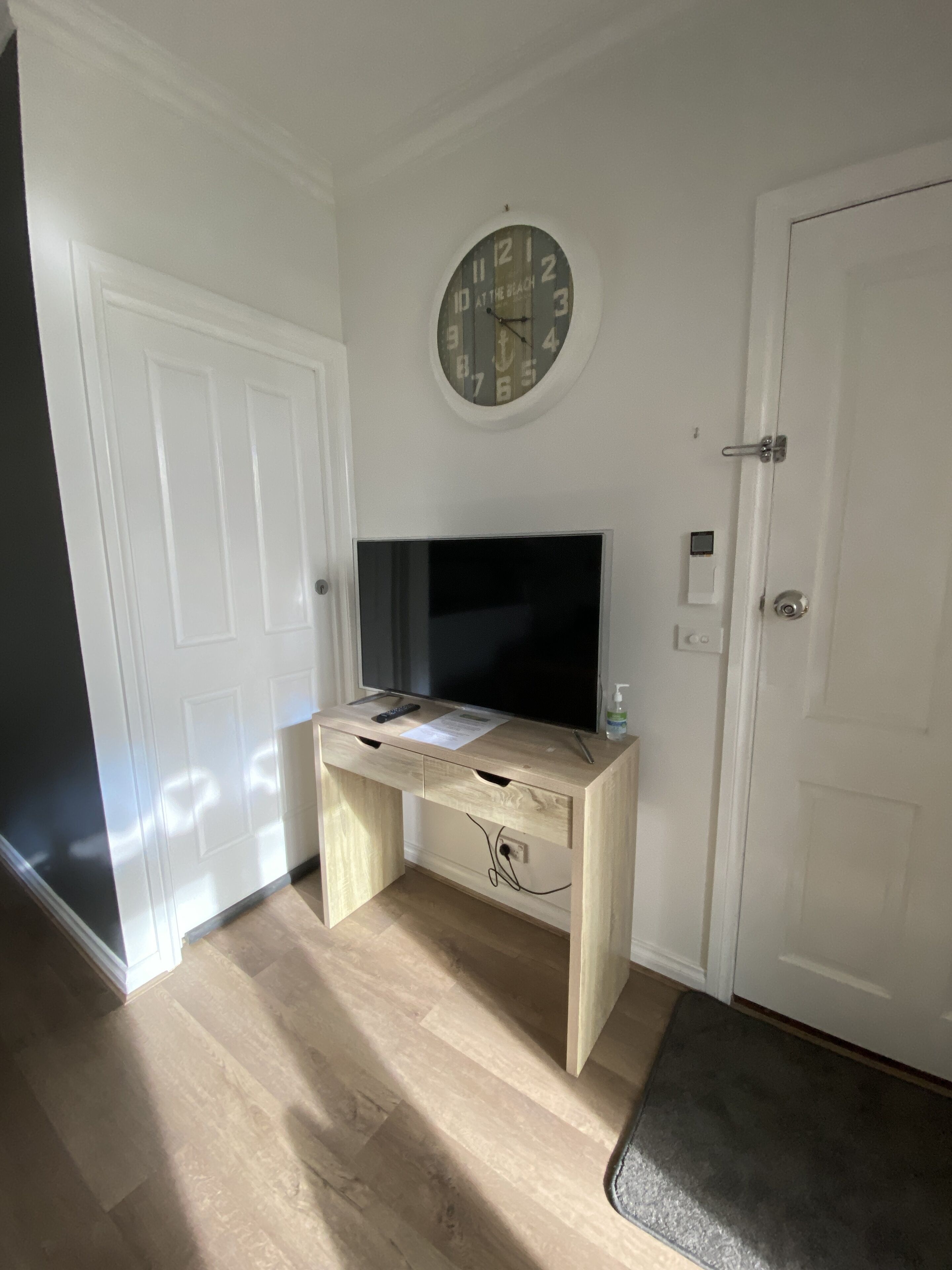 1 bedroom apartment  (unit 6) | living area | 42-inch smart tv with digital channels, dvd player