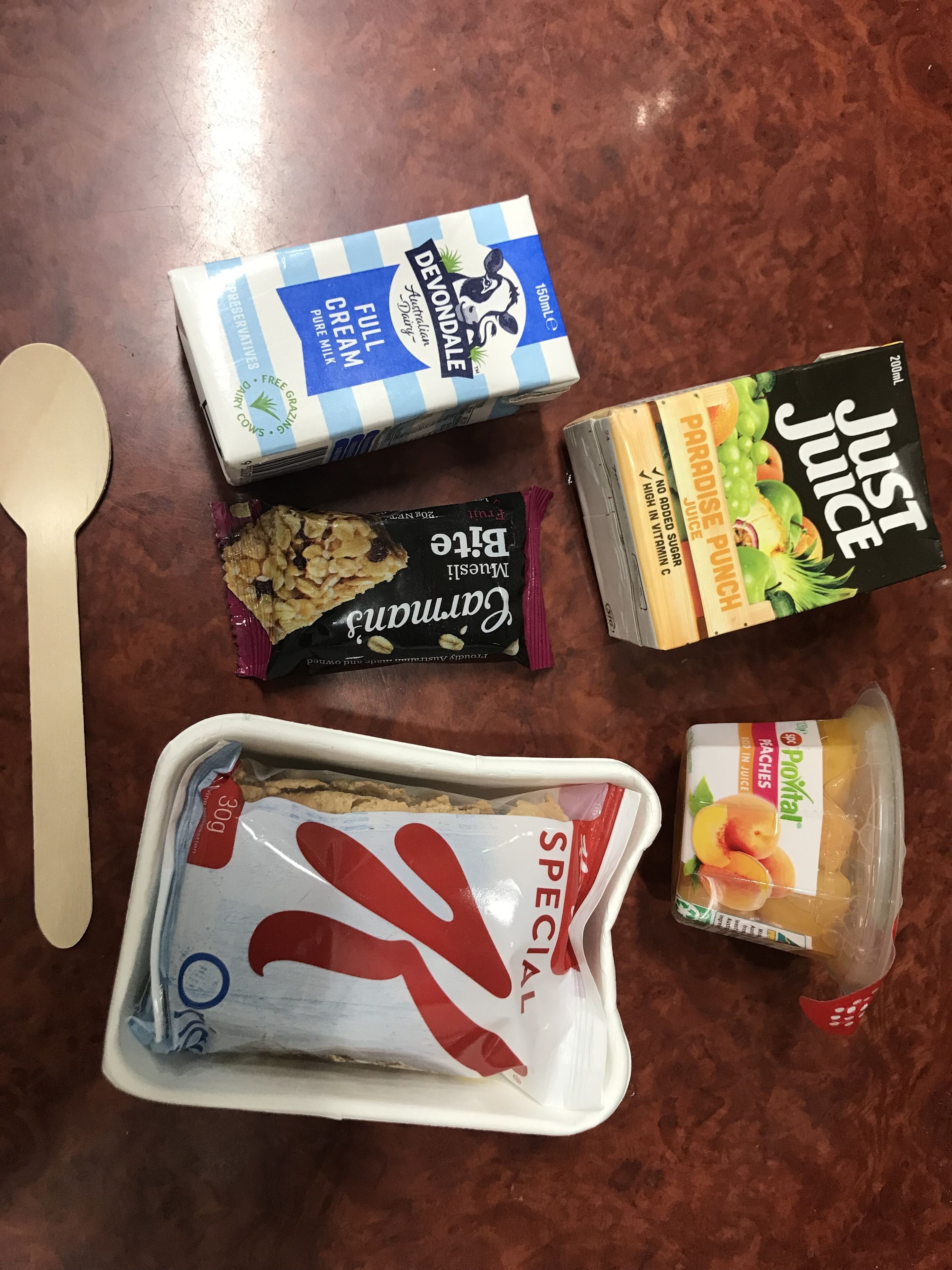 A variety of food items including Devon's Full Cream Milk, Just Juice, Blue Diamond Chocolate, and Poxtal Peach Juice.