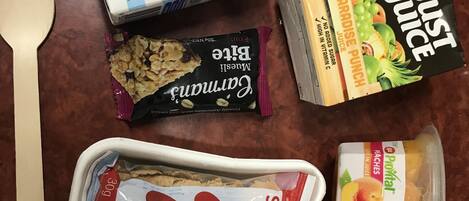A variety of food items including Devon's Full Cream Milk, Just Juice, Blue Diamond Chocolate, and Poxtal Peach Juice.
