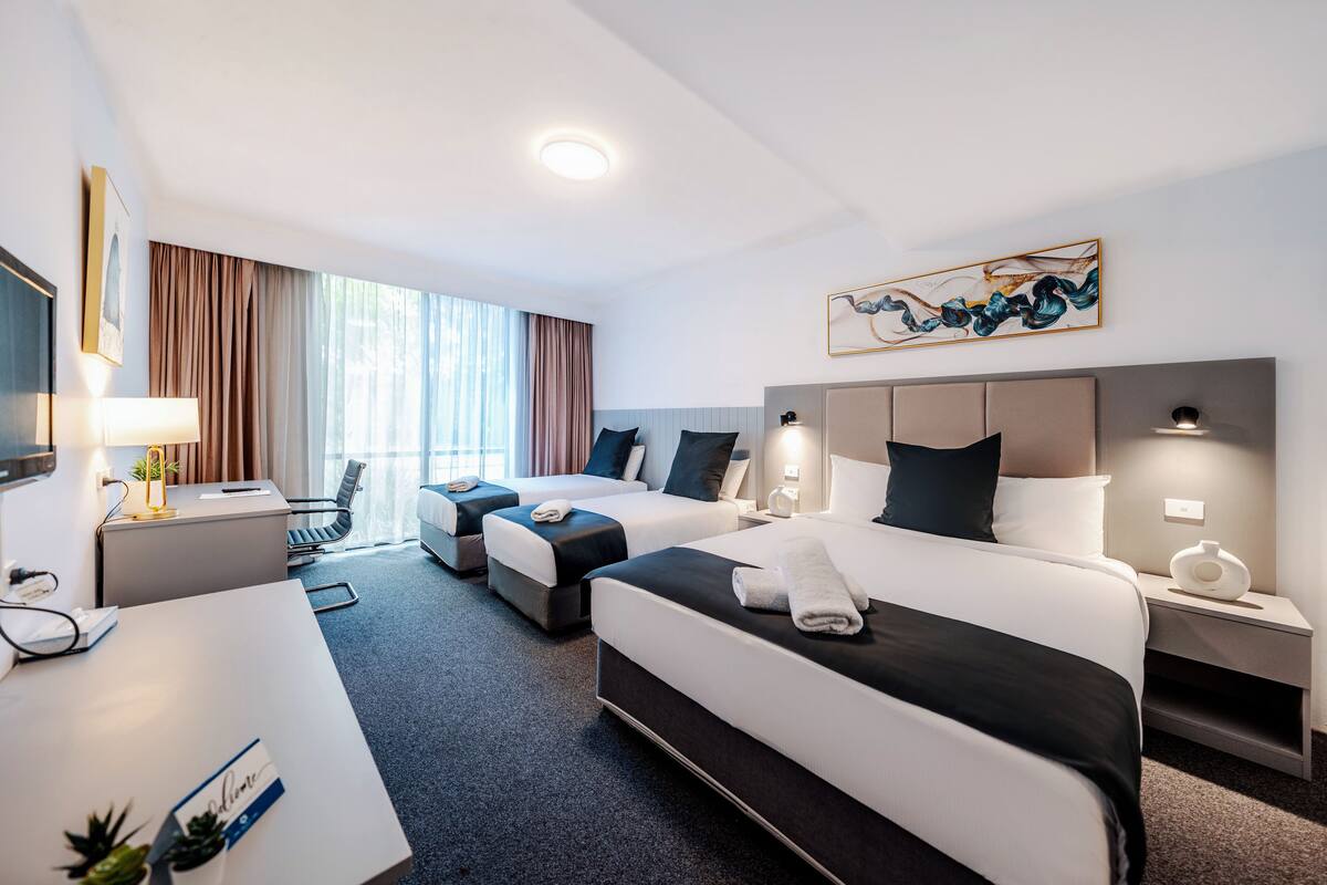 family room | 1 bedroom, in-room safe, desk, blackout curtains