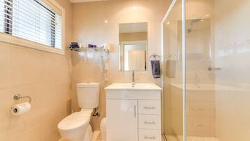 Shower, rainfall showerhead, hair dryer, towels