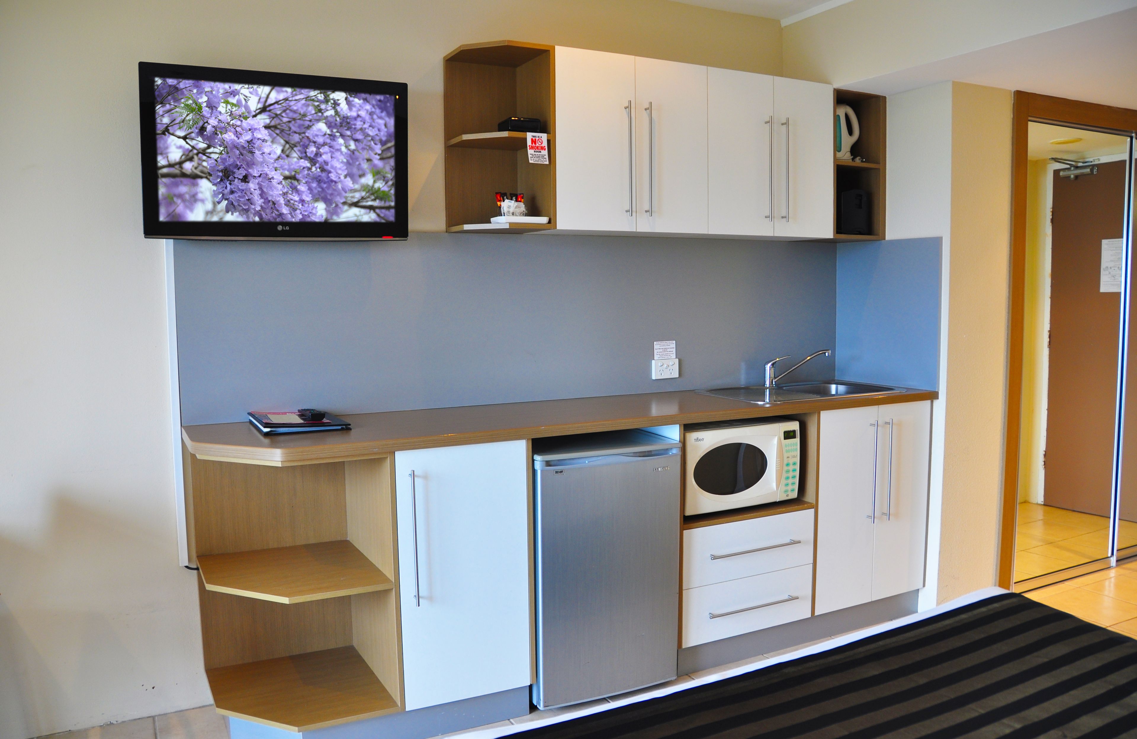 mini-fridge, microwave, electric kettle, toaster