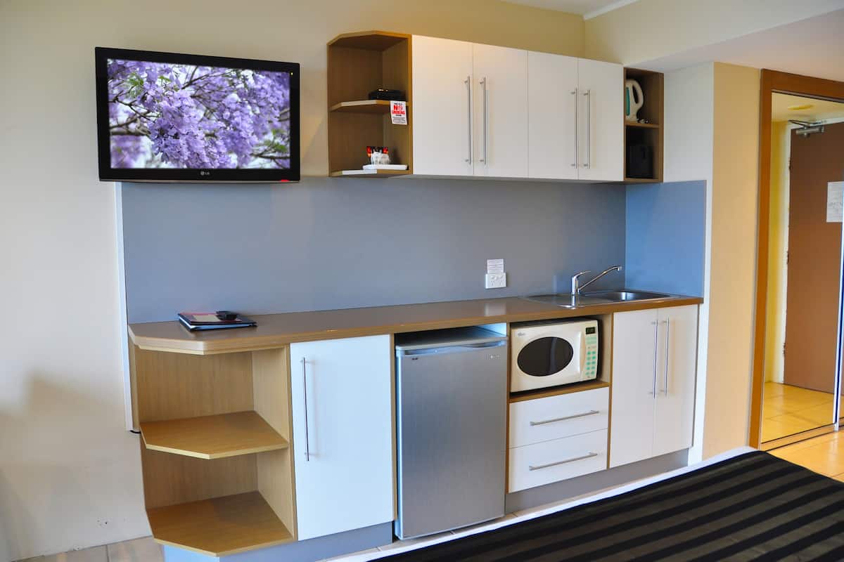 mini-fridge, microwave, electric kettle, toaster