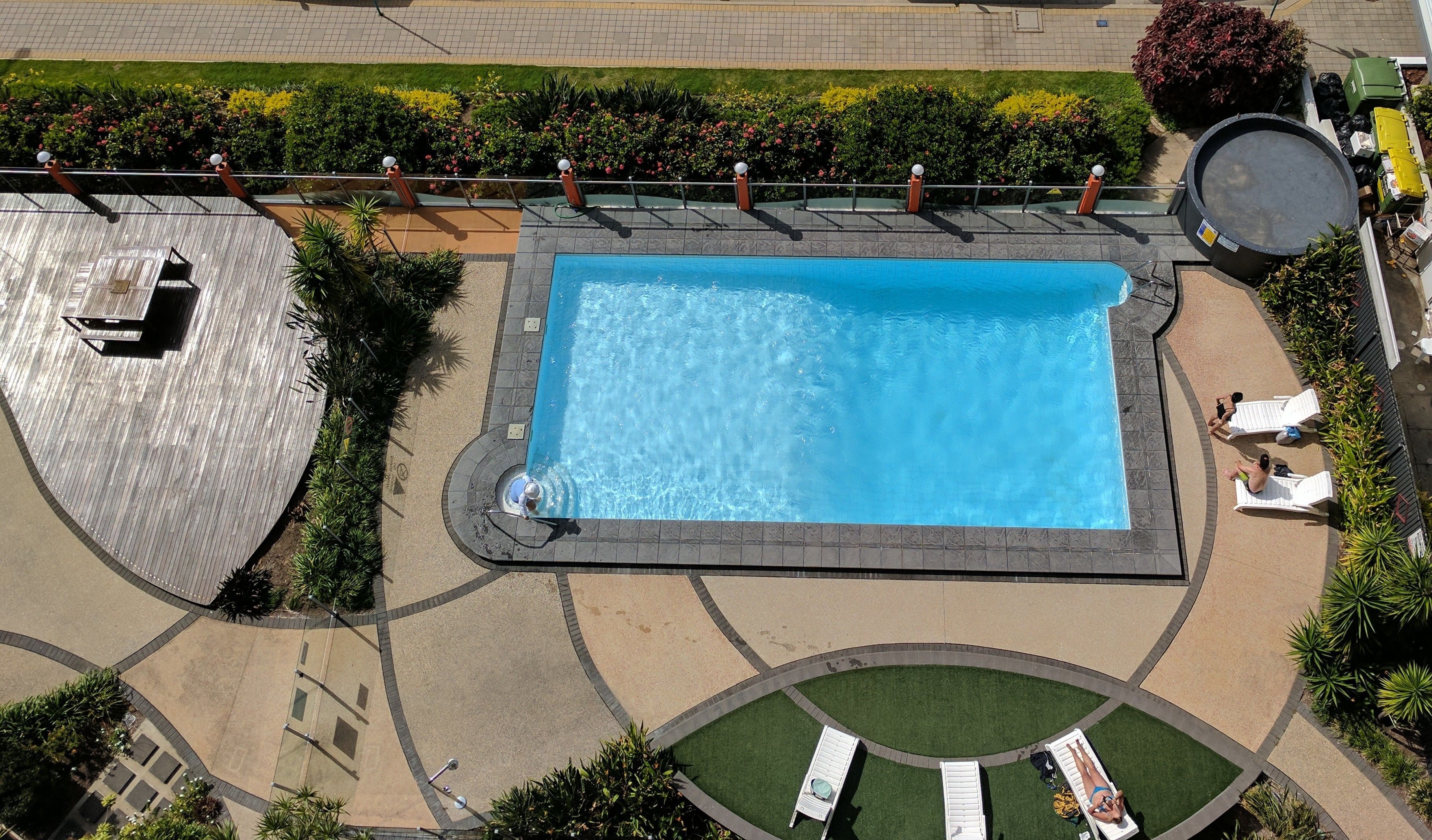 outdoor pool, open 6 am to 9:00 pm, pool loungers