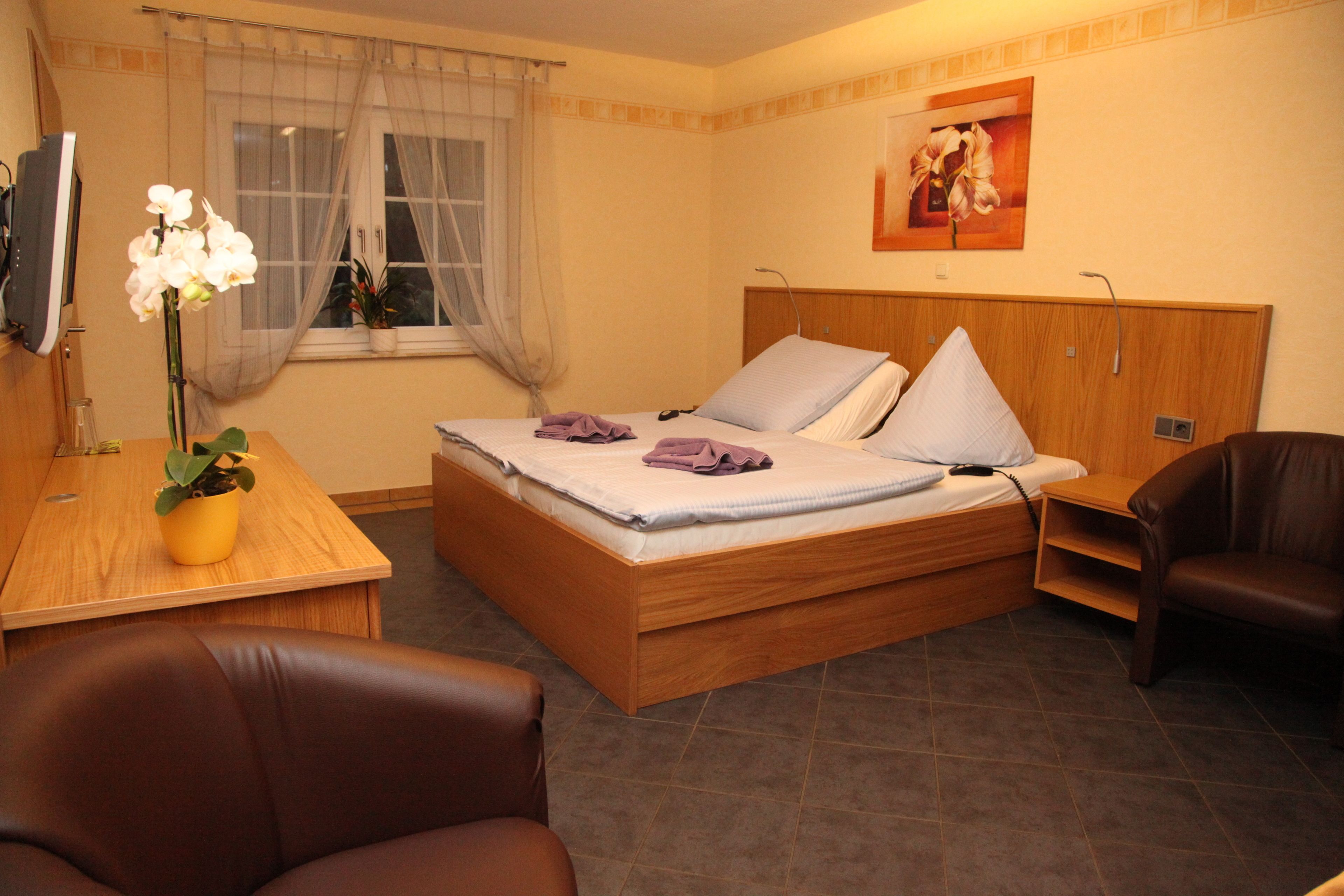 Hypo-allergenic bedding, down duvets, pillow-top beds, in-room safe