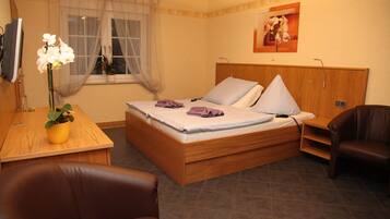 Hypo-allergenic bedding, down duvets, pillow-top beds, in-room safe