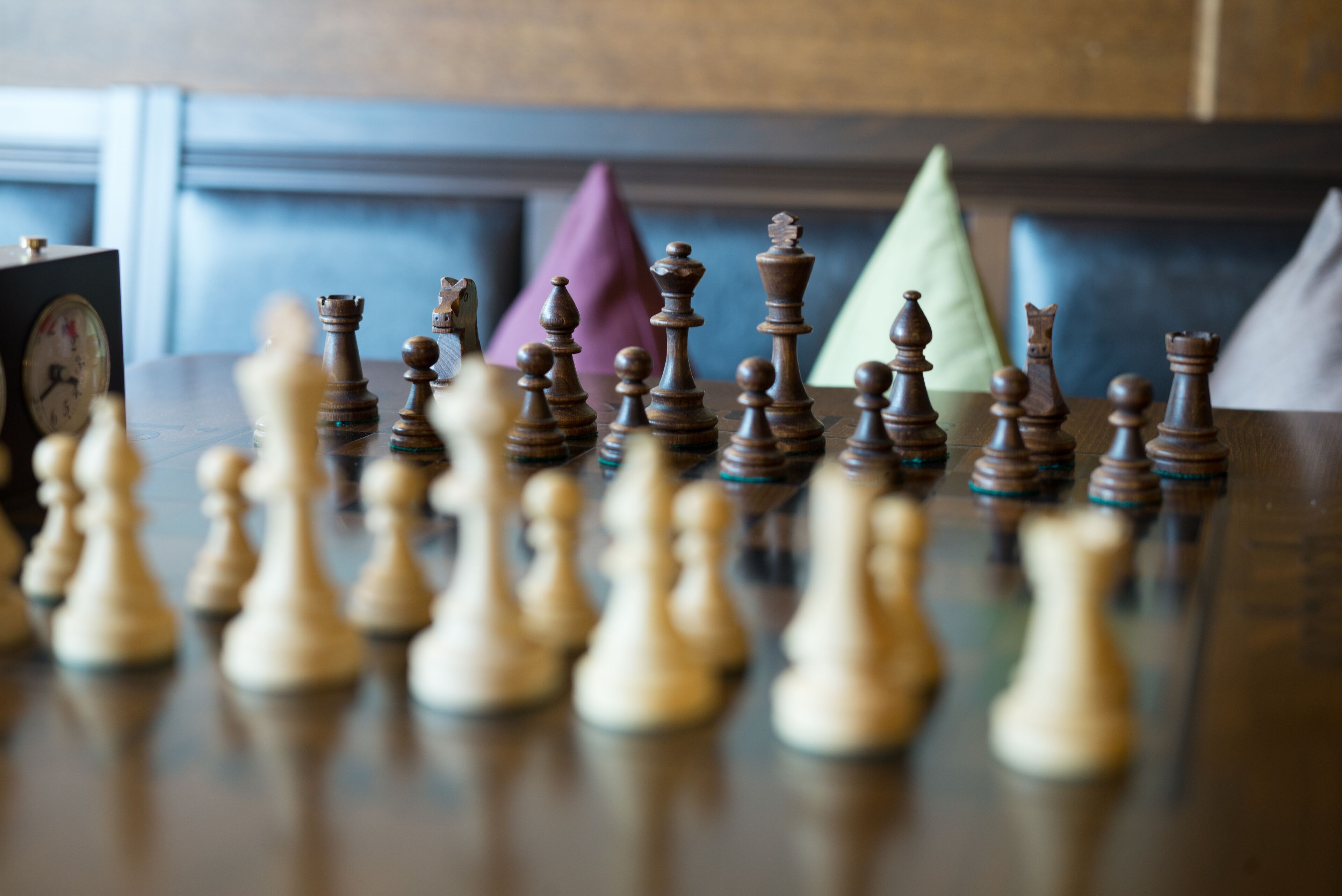 A chessboard with pieces arranged in a game.