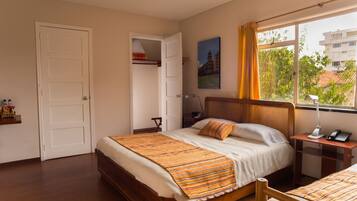 Family Room, Multiple Beds | Down comforters, minibar, in-room safe, desk