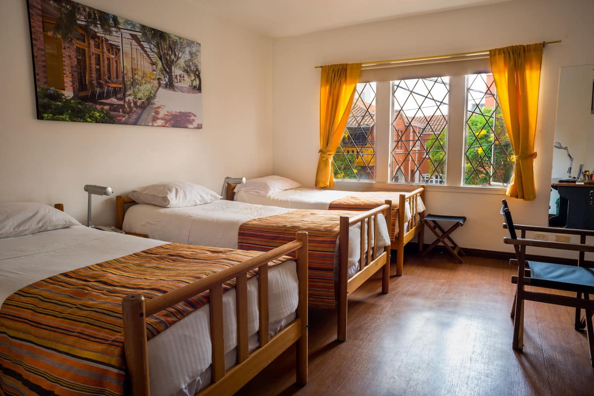 Family Room, Multiple Beds | Down comforters, minibar, in-room safe, desk