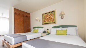 A hotel room with two single beds, a wooden wardrobe, a wall-mounted artwork, and a bedside table with a lamp. - San Isidro Inn (Lima)