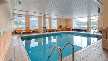 Indoor pool, pool umbrellas, sun loungers