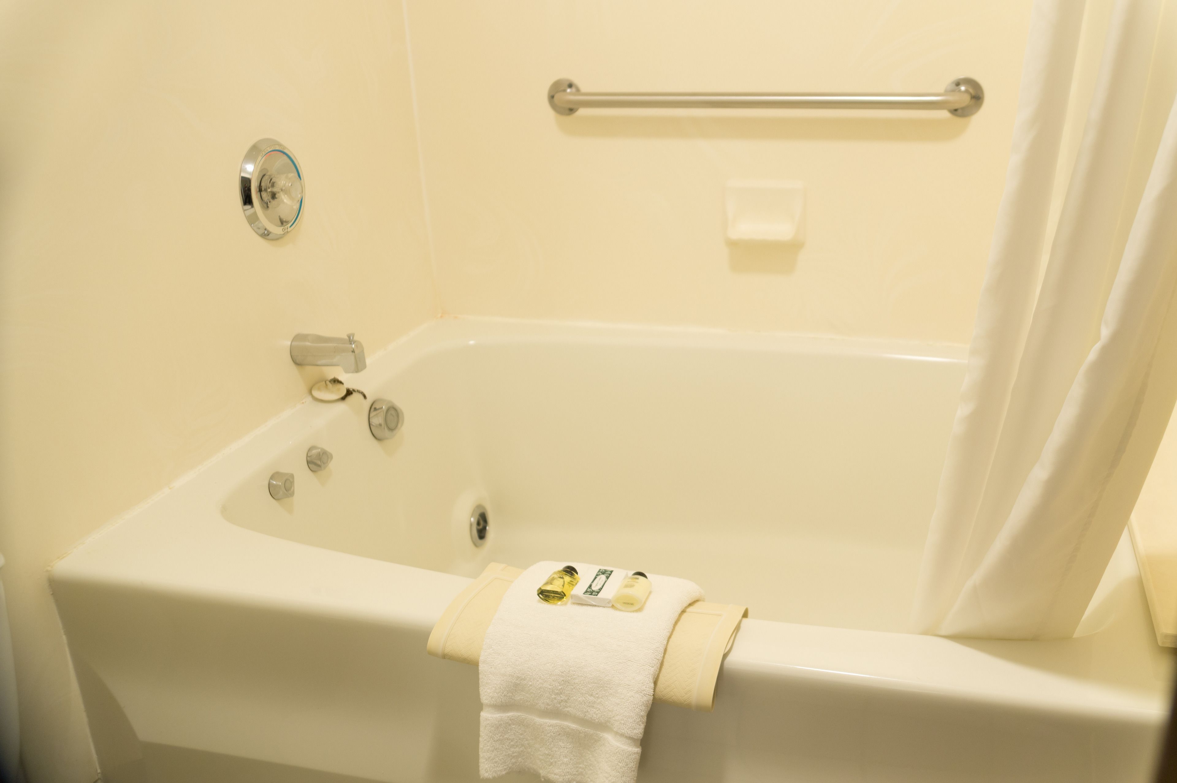 Suite, 1 King Bed, Non Smoking | Bathroom | Rainfall showerhead, free toiletries, hair dryer, towels