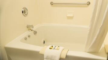 Suite, 1 King Bed, Non Smoking | Bathroom | Rainfall showerhead, free toiletries, hair dryer, towels