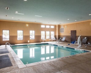 Indoor pool, open 9:00 AM to 9:00 PM, pool loungers