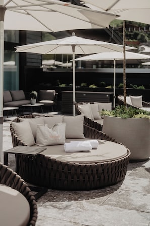 Indoor pool, outdoor pool, pool umbrellas, pool loungers -  Hotel Berghof | St. Johann in Salzburg (Sankt Johann im Pongau)