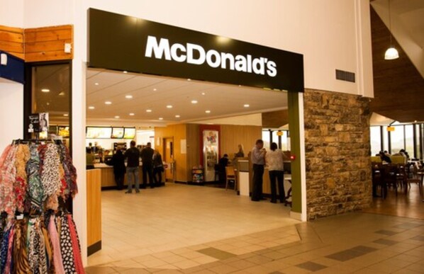 A McDonald's restaurant with a stone facade and a tiled floor. - Days Inn by Wyndham Kendal Killington Lake (Kendal)