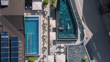 2 outdoor pools, open 7:00 AM to 10:00 PM, pool umbrellas, sun loungers