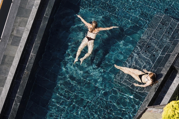 2 outdoor pools, open 7:00 AM to 7:00 PM, pool umbrellas, sun loungers