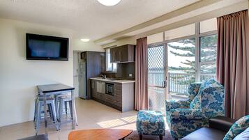 Waterfront Suite | Living area | TV, iPod dock