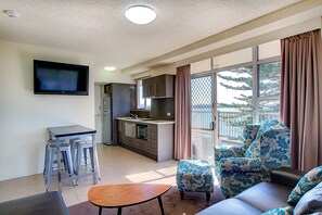 Waterfront Suite | Living area | TV, iPod dock