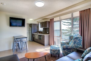 Waterfront Suite | Living area | TV, iPod dock