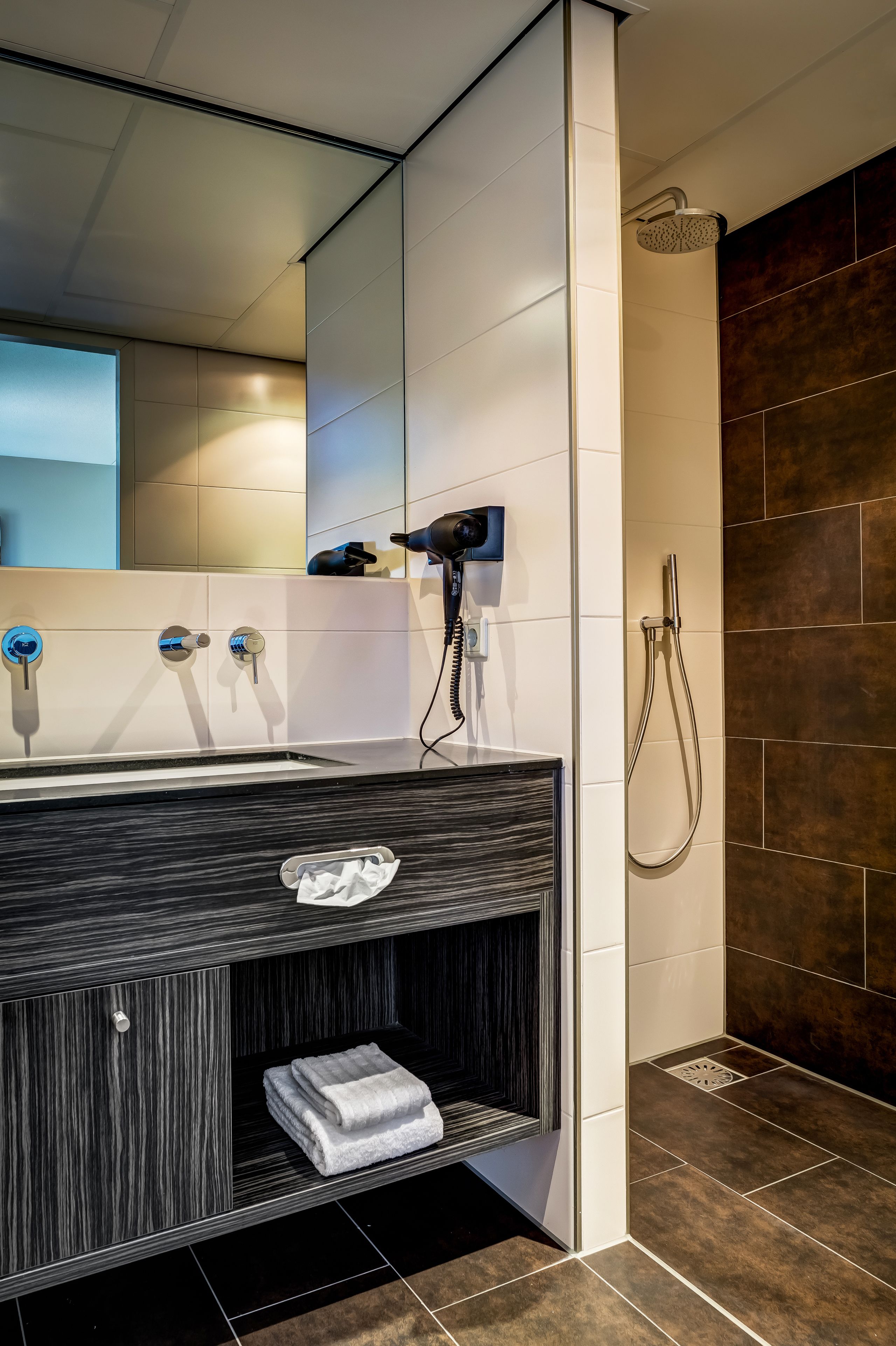 shower, rainfall showerhead, eco-friendly toiletries, towels