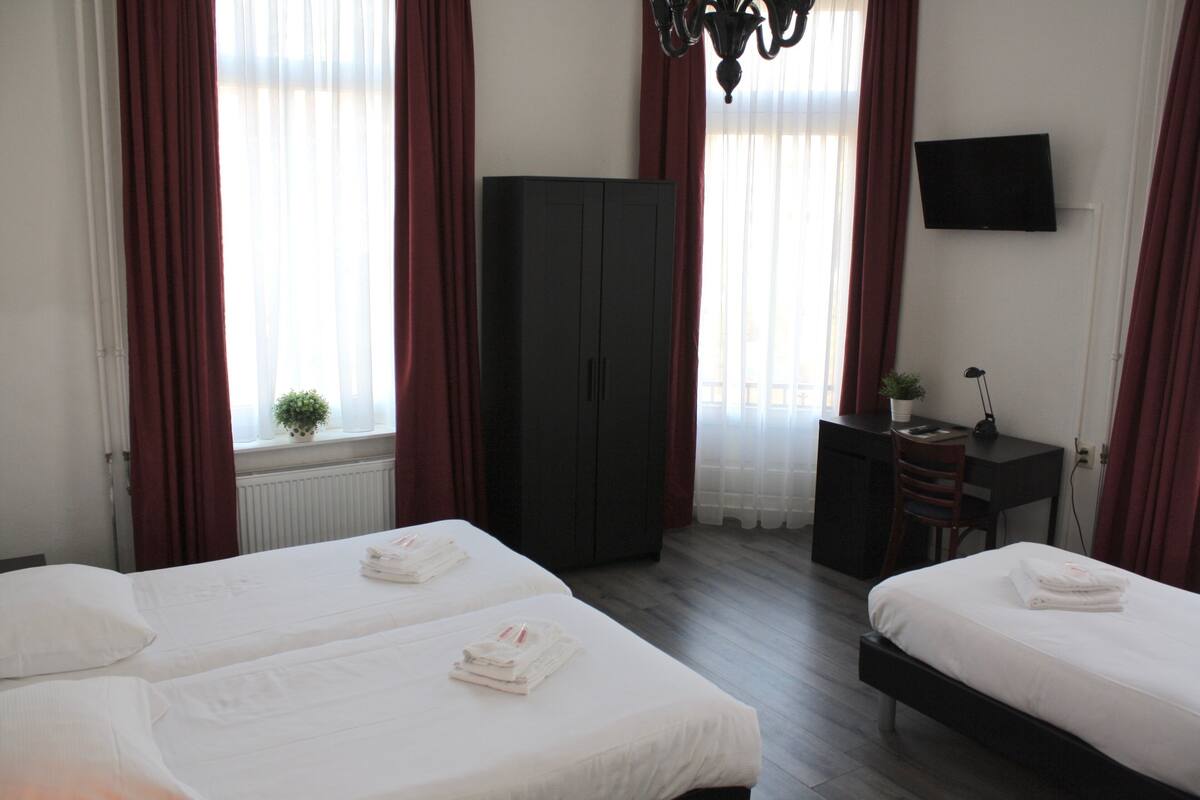 Desk, blackout drapes, iron/ironing board, cribs (surcharge)