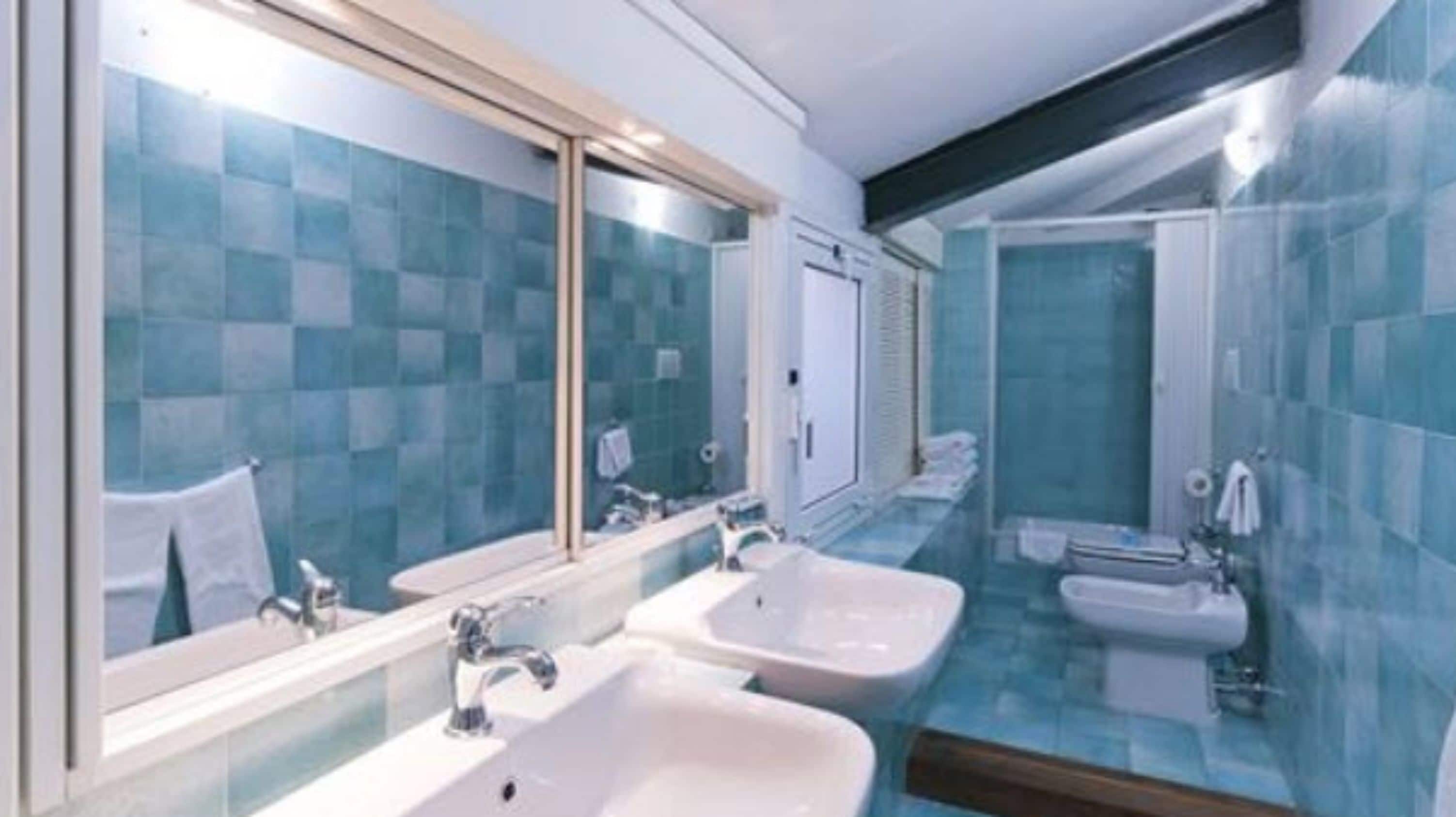 superior double room | bathroom | shower, free toiletries, hair dryer, towels