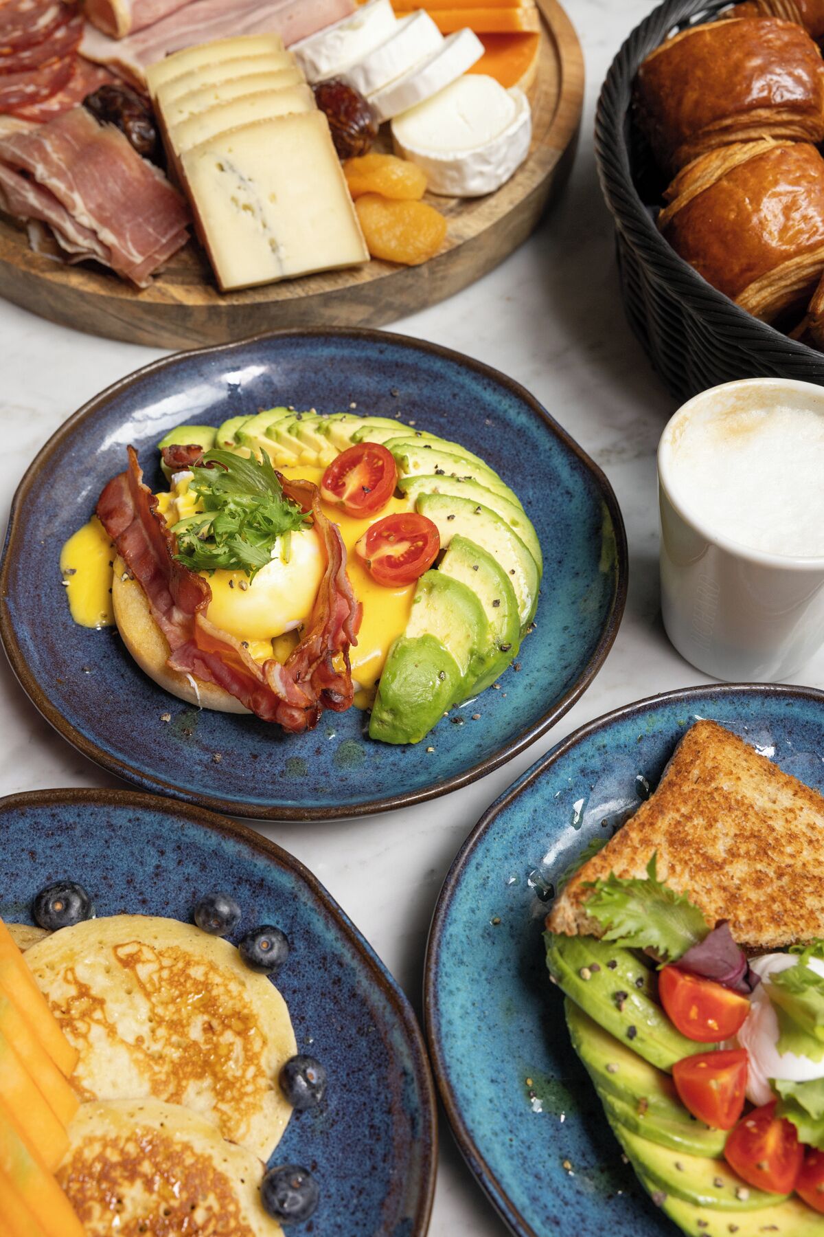A breakfast spread with various foods.