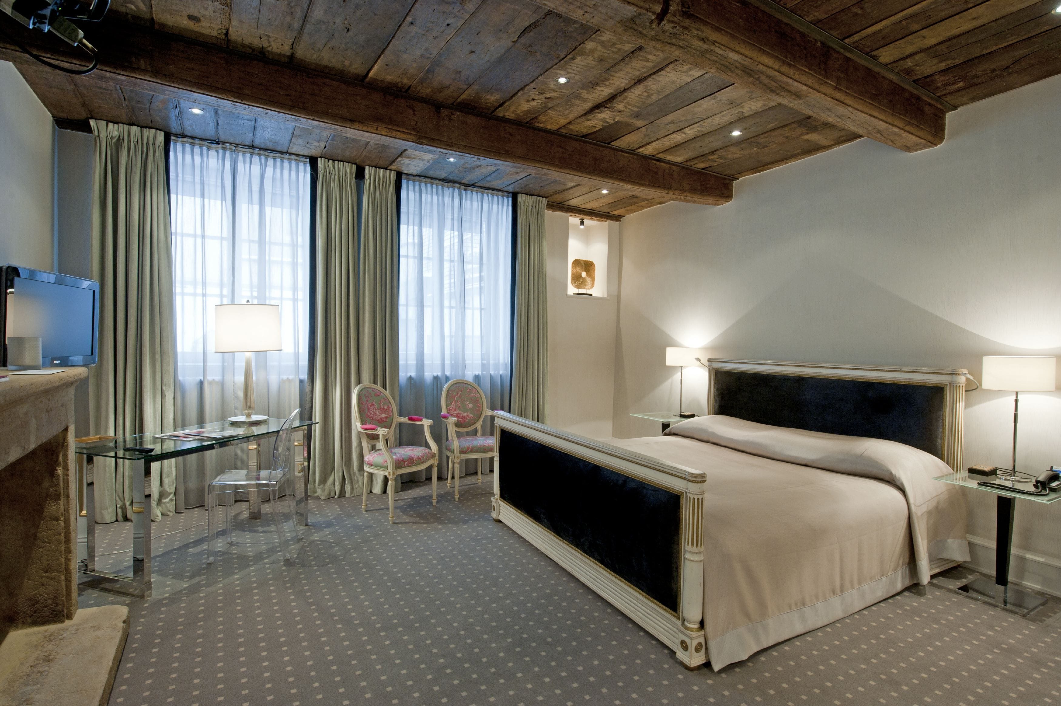 executive double room | premium bedding, minibar, in-room safe, individually decorated